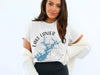 White t-shirt with "Lake Lanier Georgia" and blue compass design.