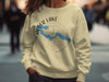 Light yellow sweatshirt featuring Alder Lake, Washington map with compass graphic on front.