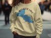 Tan sweatshirt with blue Clearwater Lake, MN map and compass graphic.