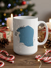 White mug with blue Red Lake, Minnesota map design, surrounded by Christmas decorations.