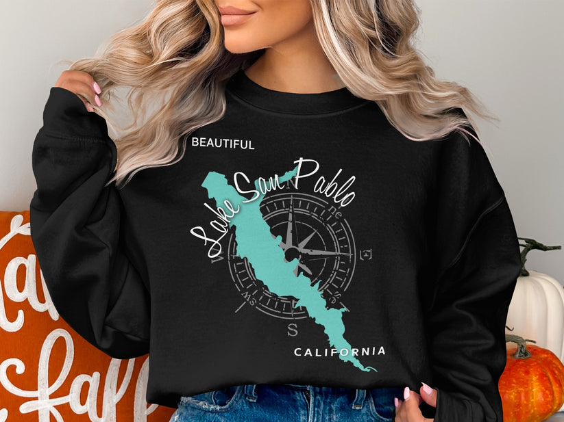 Black sweatshirt with a teal map of Lake San Pablo and compass graphic.
