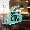 Teal sticker with "Merrill Creek Life" text and Lake Lodge Media LLC copyright.