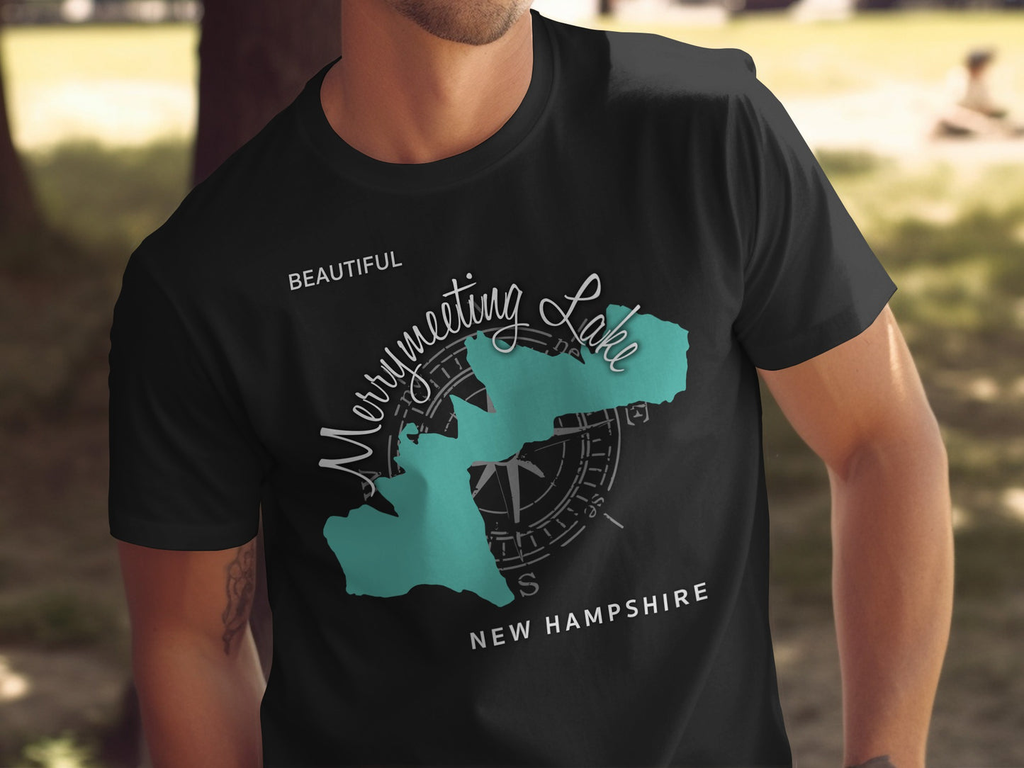 Black t-shirt with compass and "Merrymeeting Lake New Hampshire" text.