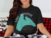 Black t-shirt featuring a teal map of Lake Manawa in Iowa with compass design.