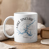 White mug with Lake Sinclair Georgia map design and compass rose.