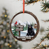Round ornament with bear, cardinal, cabin, and customizable text.