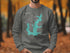 Grey sweatshirt with teal outline of Lake Lavon and compass rose.