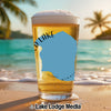 Glass of beer on beach, with text "D LAKE MINNESOTA" and Lake Lodge Media logo.