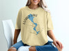Yellow t-shirt with "Lizard Lake Minnesota" text and a compass design.