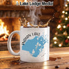 White mug with "Indian Lake Ohio" map graphic, steaming coffee, fireplace, and Christmas tree.