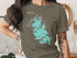 Green t-shirt with Webster Lake, Massachusetts map graphic.