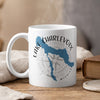 White mug with blue Lake Charlevoix map and compass design.