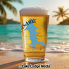 Beer glass with a blue lake outline and "NX LAKE" text on a beach background.