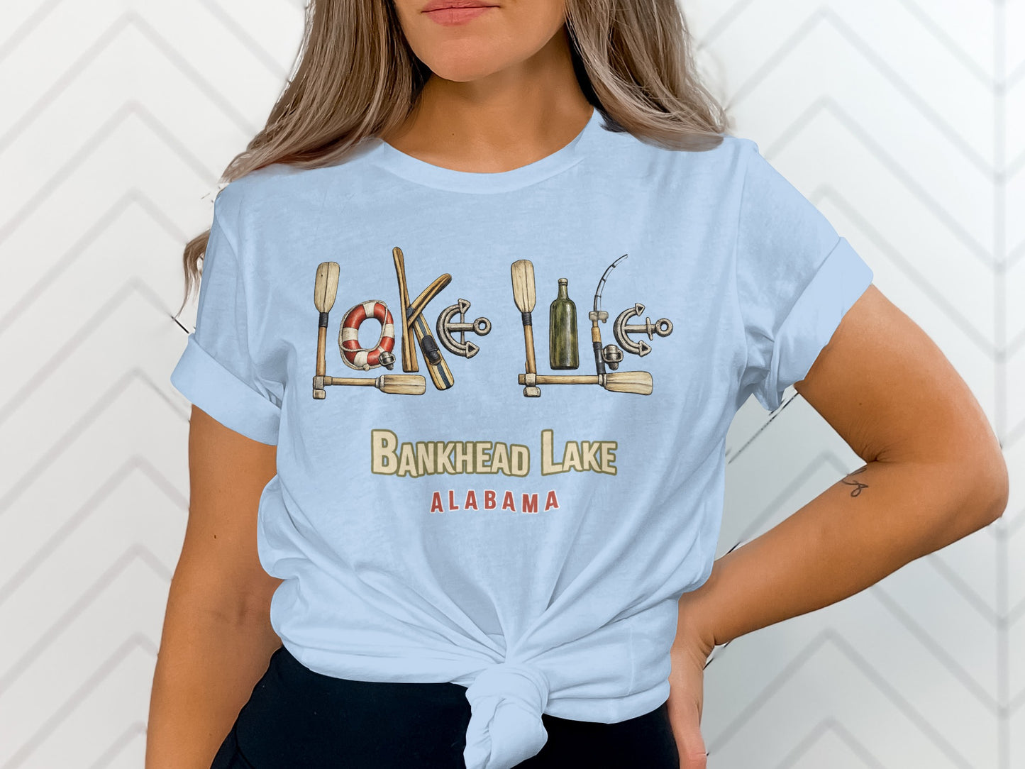 Bankhead Lake Alabama text with nautical and fishing graphics on a light blue t-shirt.