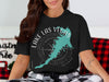 Black t-shirt featuring a teal Lake Las Vegas map over a compass rose graphic.