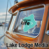 Istokpoga Life sticker on a wooden boat window, with Lake Lodge Media logo below.