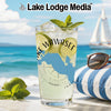 Glass of lemonade with lime slices, mint, and "Lake Wawasee" design on beach.