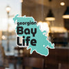 "Georgian Bay Life" text on a turquoise map-shaped sticker with white border.
