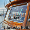 Keuka Lake Life sticker on a wooden boat with Lake Lodge Media logo.