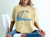 Light yellow t-shirt with Grenada Lake Mississippi map and compass graphic.