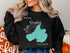 Black sweatshirt with "Beautiful Lake Mendota Wisconsin" text and map outline.