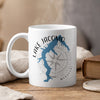 White mug with blue Lake Jacomo outline and compass graphic, "Missouri" text.