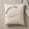 Cream pillow with Norris Lake Tennessee map and compass rose graphic.