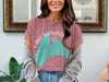 Rose-colored t-shirt with "Lake Manawa Iowa" text and teal map graphic.