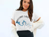 White t-shirt with Saguaro Lake Arizona text and compass design.