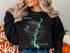 Black sweatshirt with "Beautiful Lake Tillery North Carolina" and compass graphic.