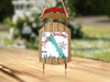 Sled ornament with "Merry Christmas from Hudson Lake" text and snowflakes.