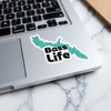 Teal outline sticker with "Bass Life" text on a laptop.