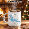 White mug with "Rainy Lake Minnesota" design and a compass rose.