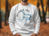 White sweatshirt with Keystone Lake Oklahoma map and compass design.