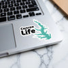 Conroe Life sticker with turquoise lake outline on a laptop.