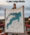 Blanket with Arcadia Lake shape and compass, on a lake background.