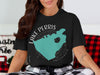 Black t-shirt graphic features teal Lake Perris California shape with compass.