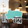 Teal sticker with "Walden Life" in black text on a white outline, on glass.