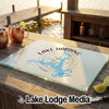 A glass cutting board featuring a blue map of Lake Harding, Georgia, rests on a wooden outdoor bar.