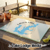 A rectangular glass cutting board featuring a blue map of Lavon Lake and compass design on a wooden table.