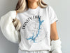 White t-shirt with Trinity Lake California graphic and compass design.