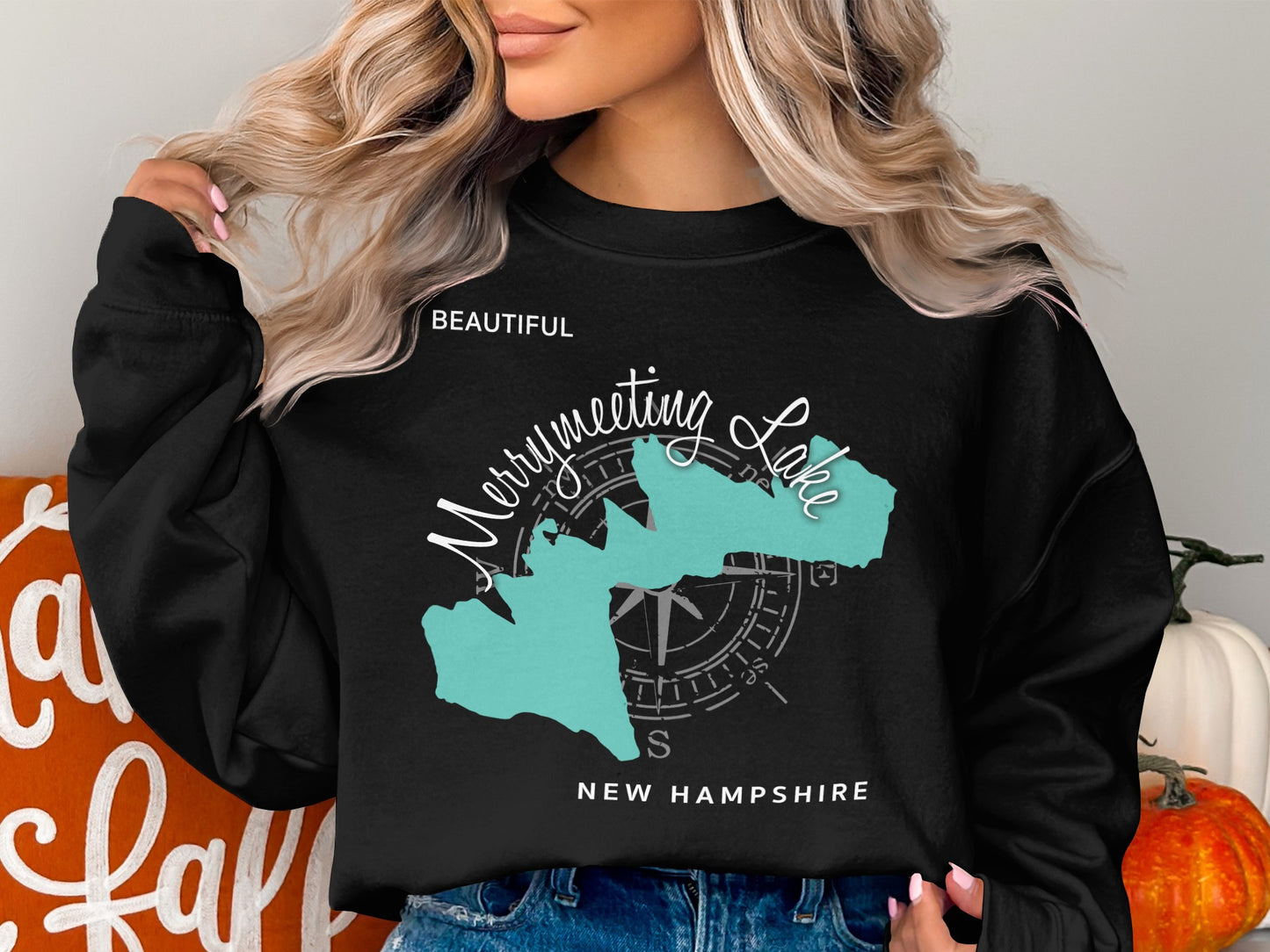Black sweatshirt with turquoise Merrymeeting Lake New Hampshire map graphic.