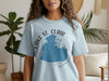 Light blue t-shirt with "Lake St. Clair Michigan" text and map outline.