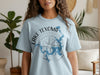 Light blue t-shirt with Lake Texoma Texas map and compass graphic.