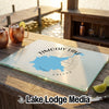 A rectangular glass cutting board featuring a map of Timothy Lake, Oregon, rests on an outdoor wooden bar.
