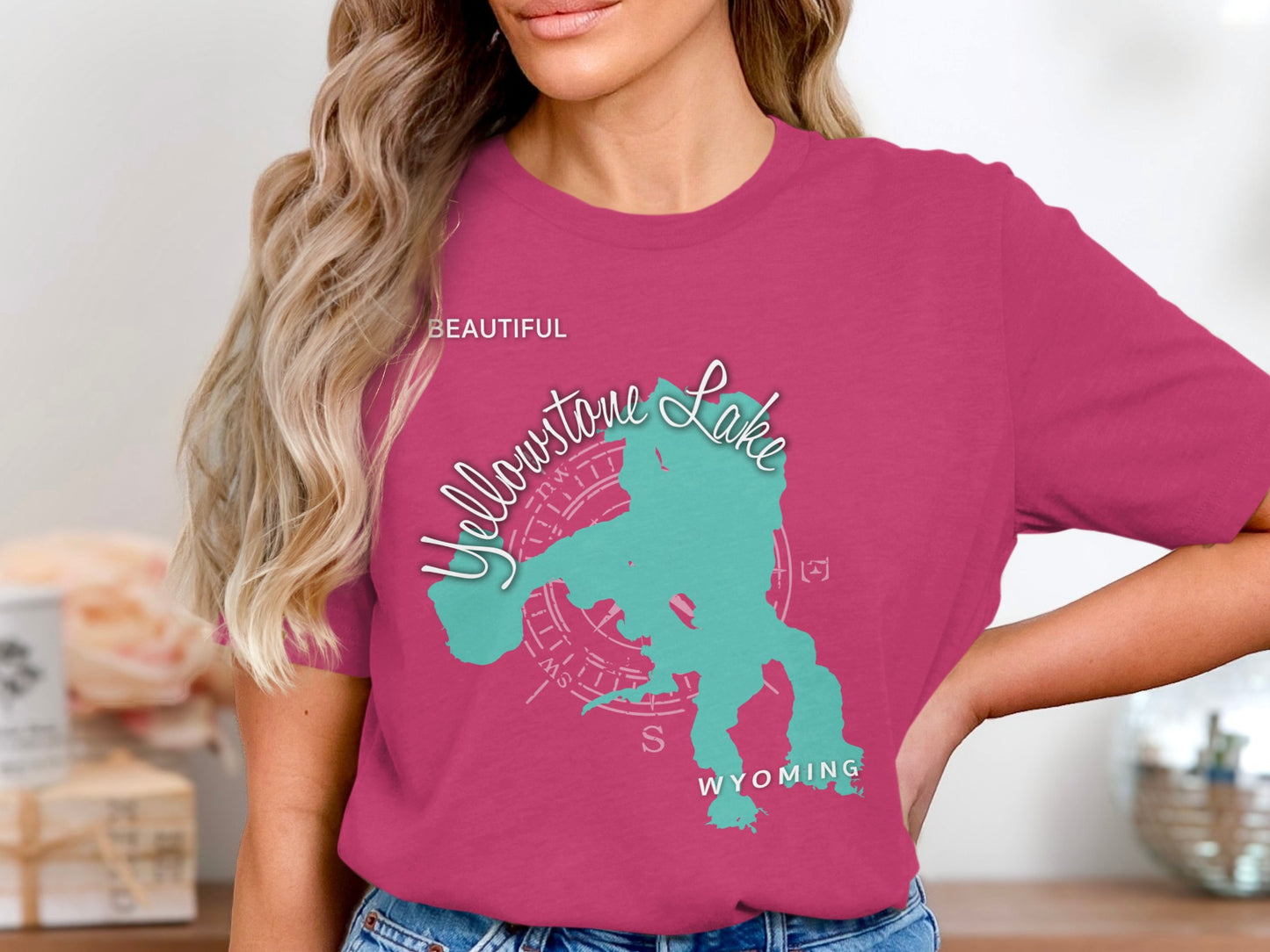 Pink t-shirt featuring a turquoise map outline of Yellowstone Lake, Wyoming.