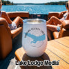 A white insulated wine tumbler featuring a blue outline map of Harlan County Lake, Nebraska, sitting on a wooden boat table.