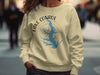 Cream sweatshirt with Lake Conroe Texas map and compass design.