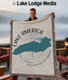 Man holding a blanket with a teal outline of the Great Lakes and "Lake America" text.