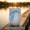 A white stemless tumbler with a blue Grand Lake graphic and compass design on a wooden dock.